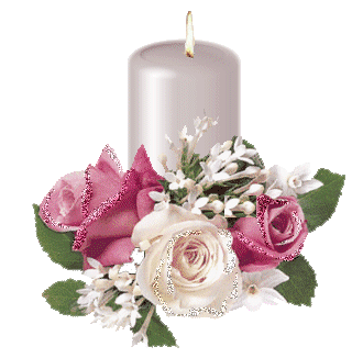 a white candle with flowers